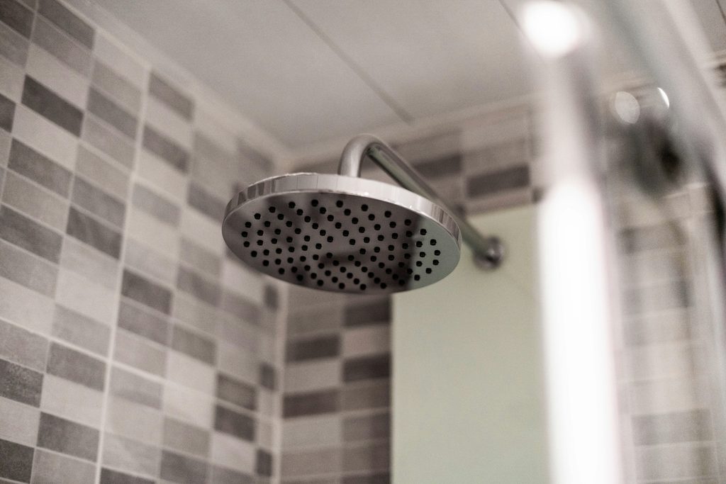 clean shower head hard water buildup